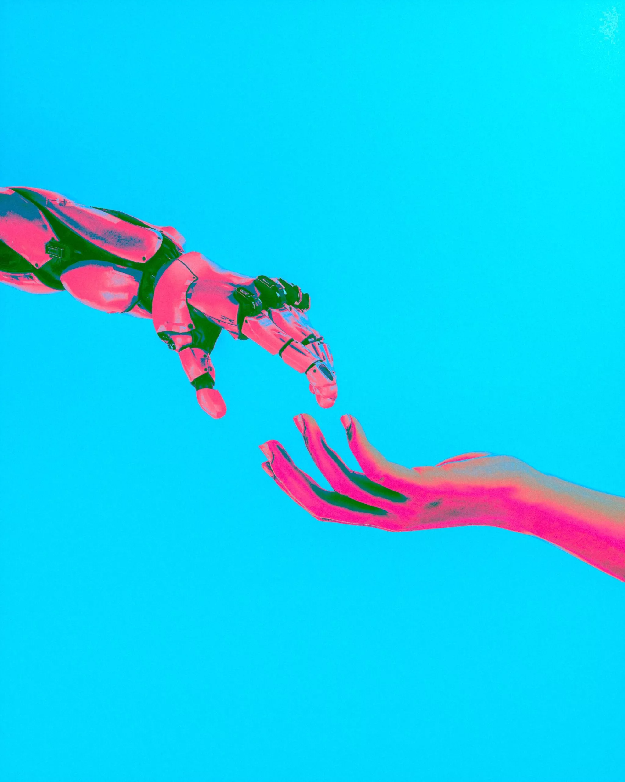 Photo d’une main humaine et robotique qui se touchent Image de Cash Macanaya sur Unsplash