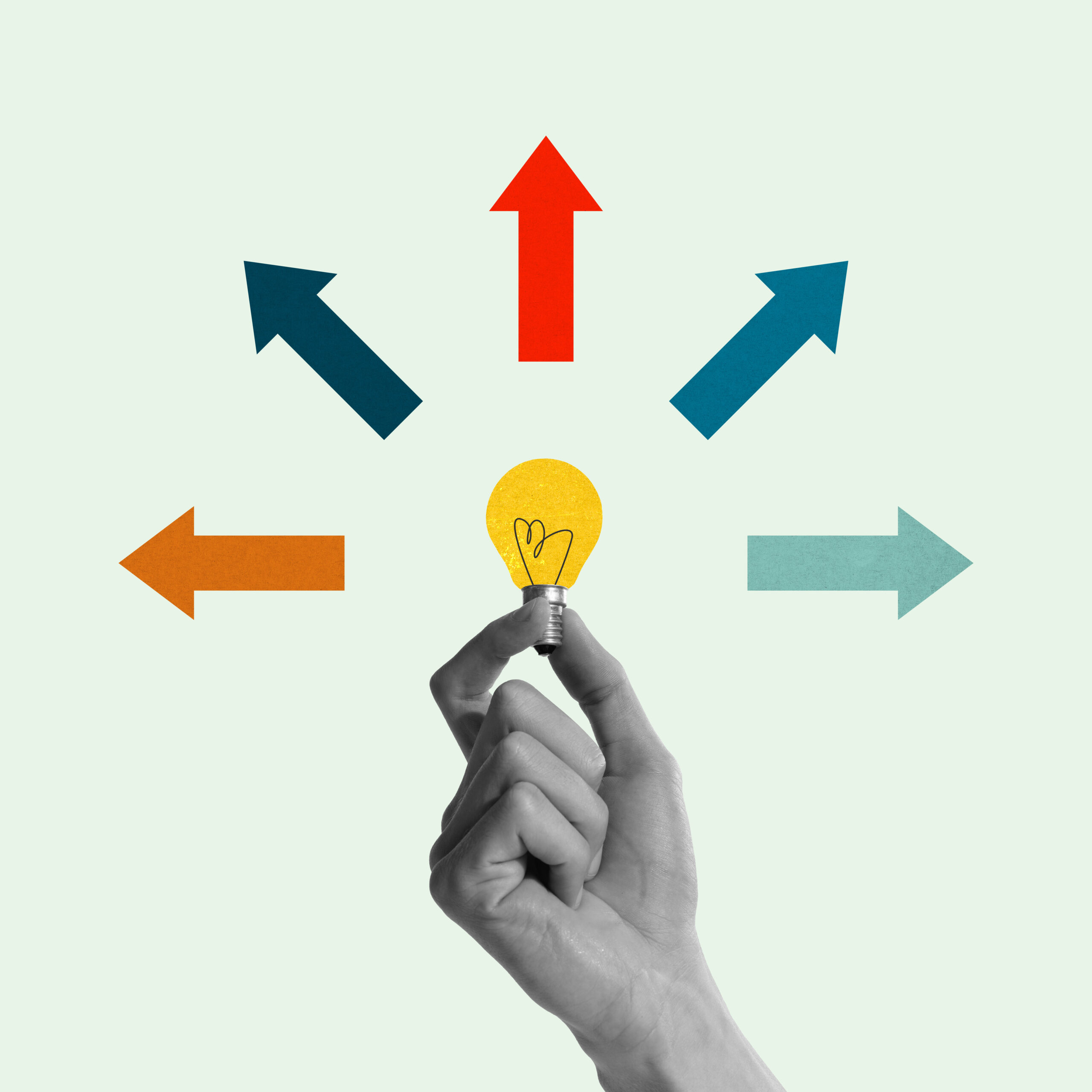 Hand holding glowing lightbulb with multicolored arrows pointing in multiple directions, representing new ideas and many creative paths. Contemporary art. Concept of business, progress, achievement